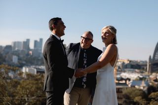 Josh Withers conducting a Sydney wedding ceremony overlooking the harbour