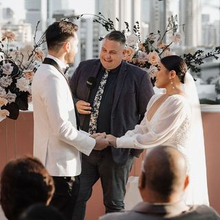 Josh Withers conducting a Brisbane wedding ceremony with a couple