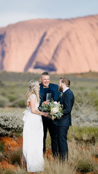 Josh Withers conducting an elopement ceremony near Uluru